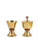 CALICE E PISSIDE DORATI CON MARTELLATURA E PIETRE ROSSE